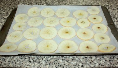 Apple slices on cookie sheet