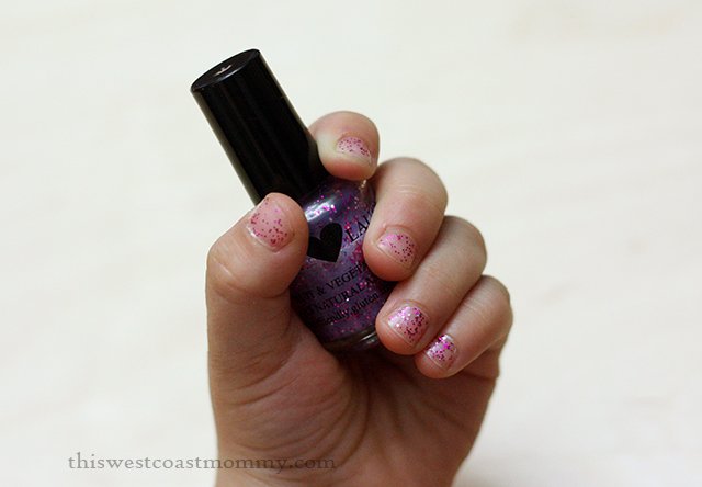 Pink Fairy Twinkle kid-safe nail polish on the left hand