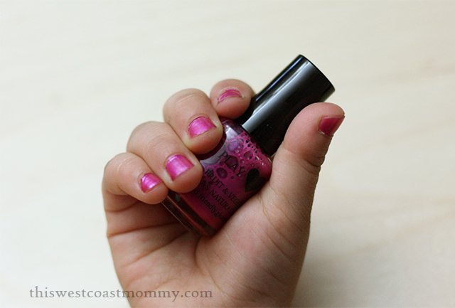 Rose Posie kid-safe nail polishes on the right hand