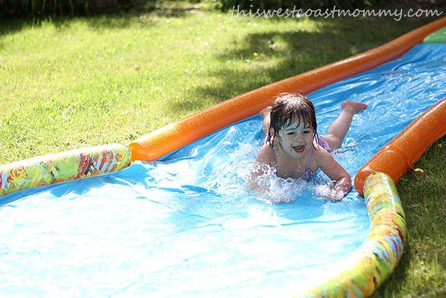 The Slide & Surf water slide is just about the most fun the kids will have in the backyard all summer!