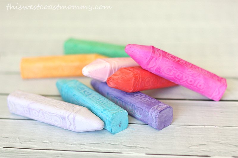 close up coloured chalk on white wood