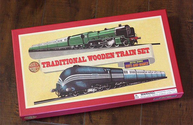 The Traditional Wooden Train Set comes with two engines, four train cars, a station house, and over five feet of wooden track.