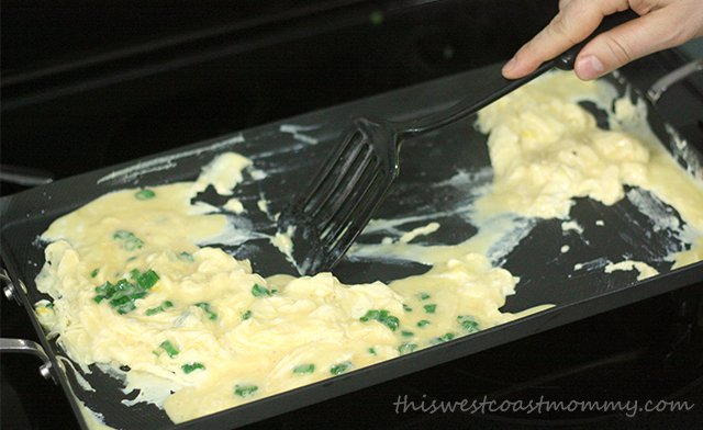 Make two separate batches of scrambled eggs on the griddle