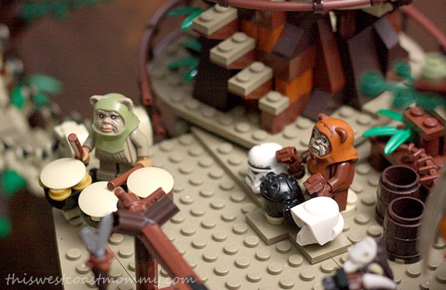 The Ewoks celebrate their victory over the Imperial forces with a feast and drumming on trooper helmets.