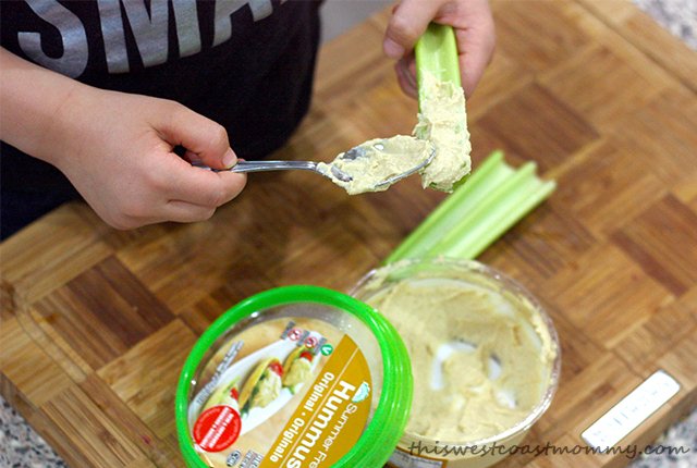 Update your classic ants on a log snack with Summer Fresh hummus. Easy, healthy, delicious, and safe for peanut-free schools!